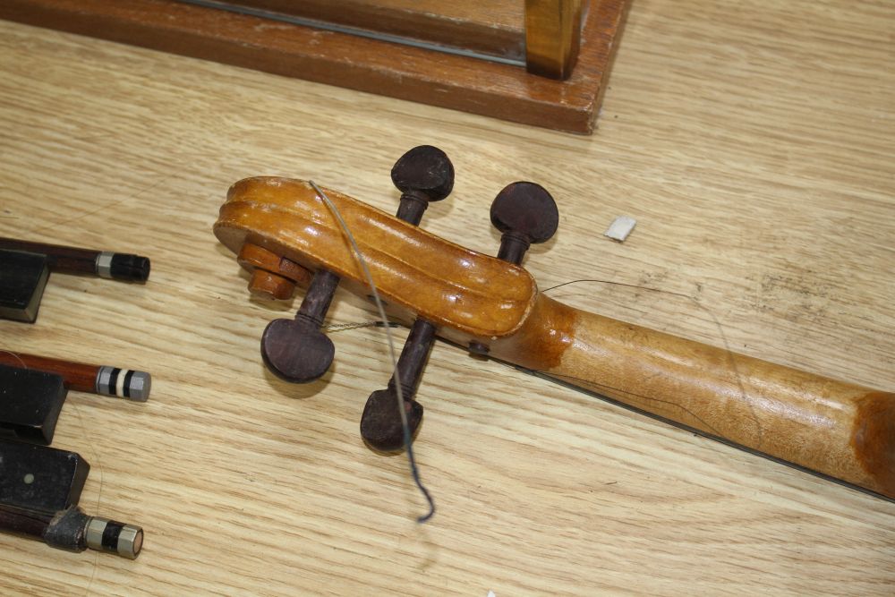 A Chinese violin and four bows